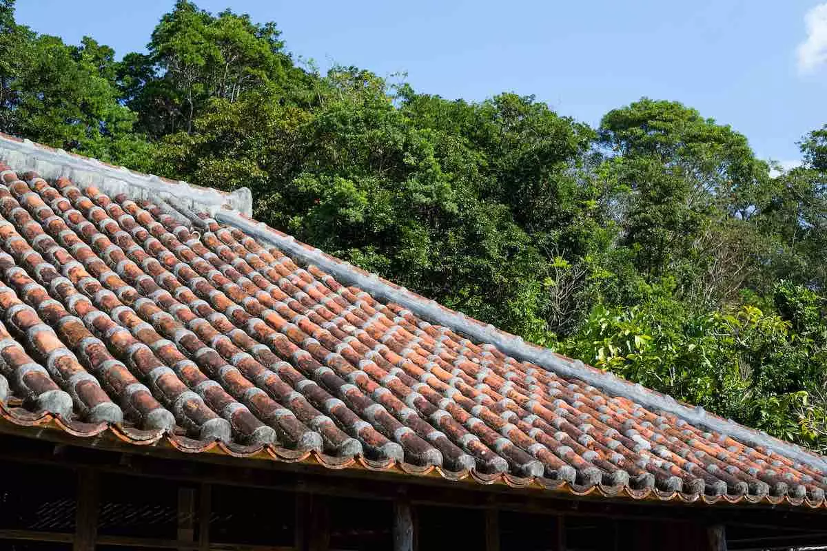 A pristine, weather-tight residential barrel tile roof configuration showing complete perimeter protection